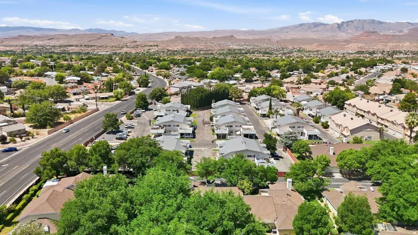 Expansive neighborhood setting featuring numerous residential properties and a visible public roadway