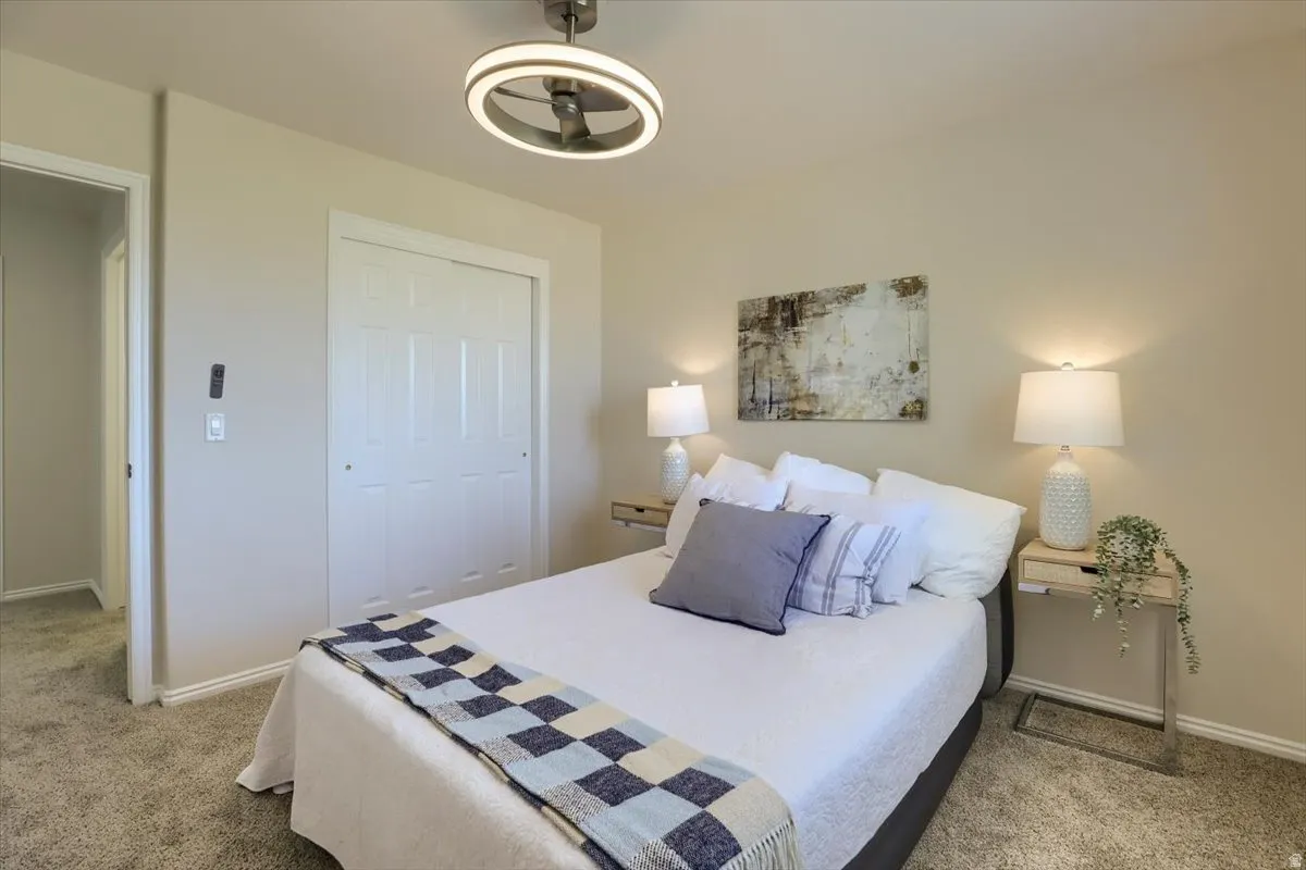 Bedroom featuring plush carpet flooring and neutral wall tones