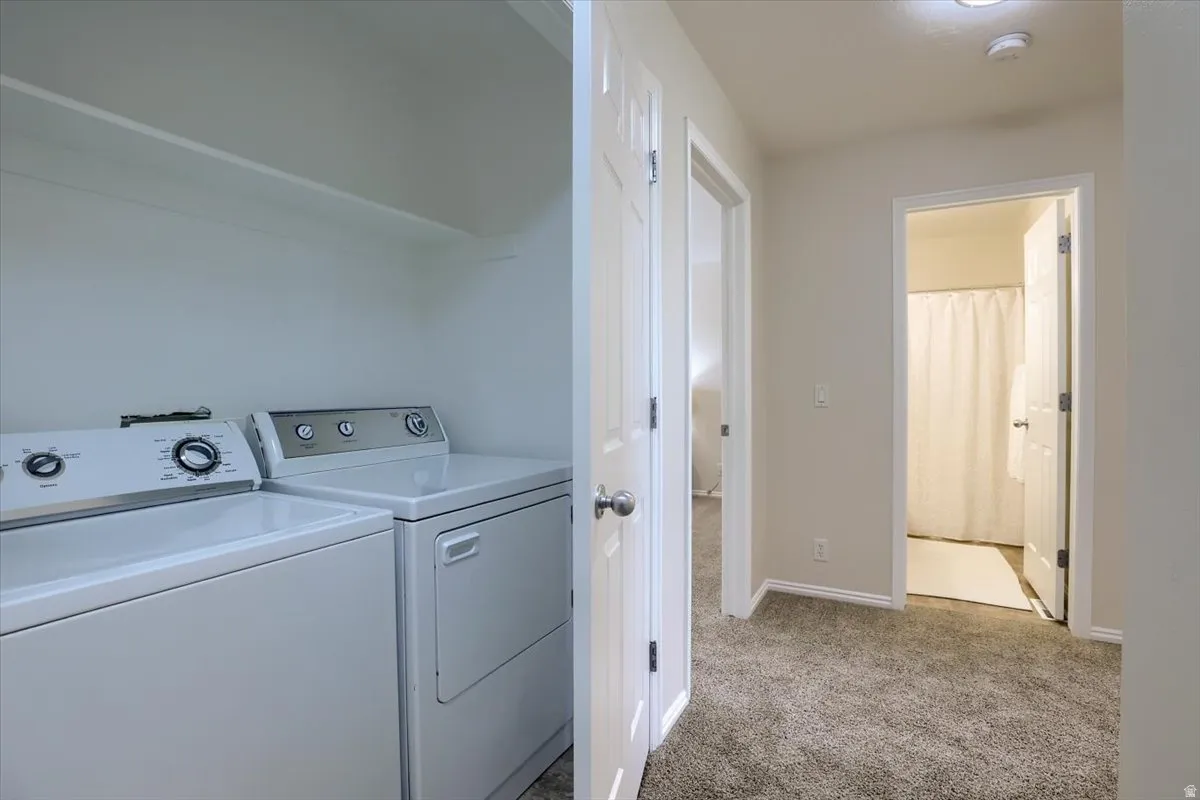Dedicated laundry area with upper shelving