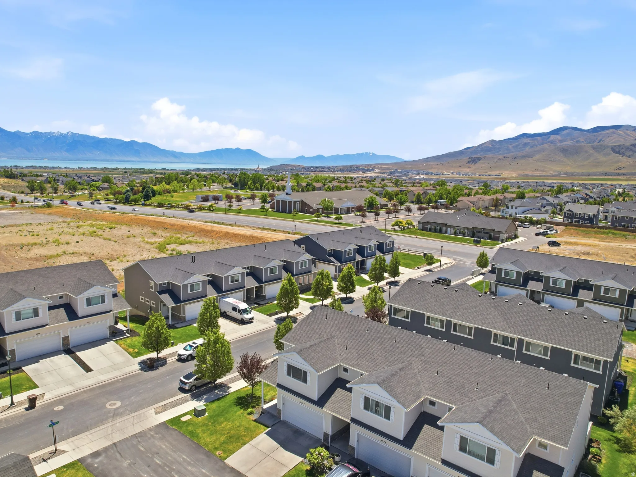 Aerial perspective showcasing a residential community with contemporary townhomes