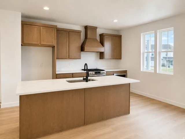 Kitchen island with an undermount sink and a matte black faucet, wood-finish cabinetry, stainless steel range with a matching hood, and wood-finish flooring