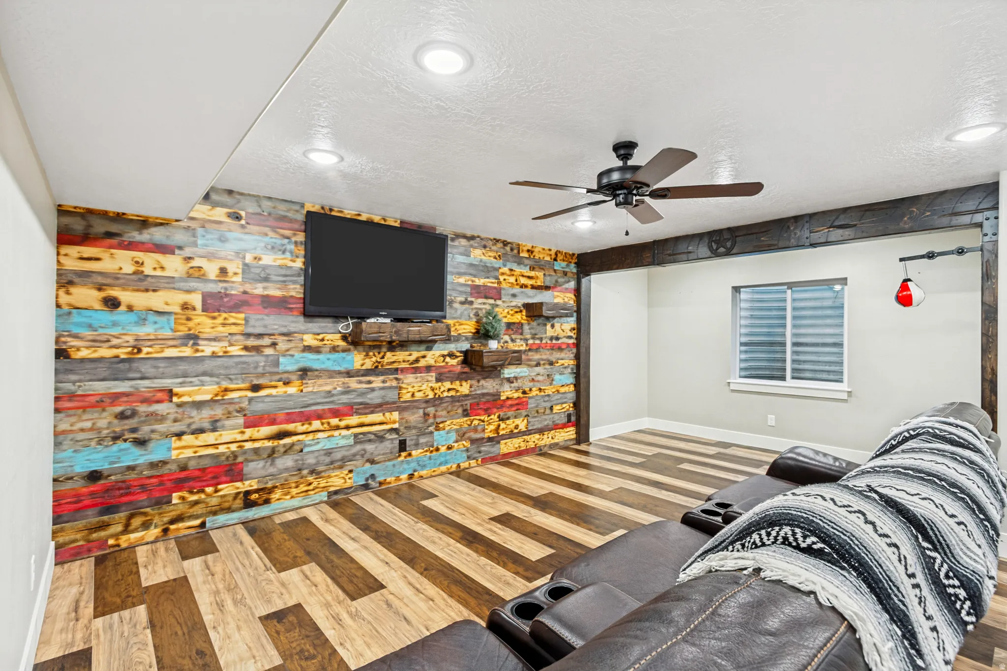 Accent wall featuring multi-color wood paneling