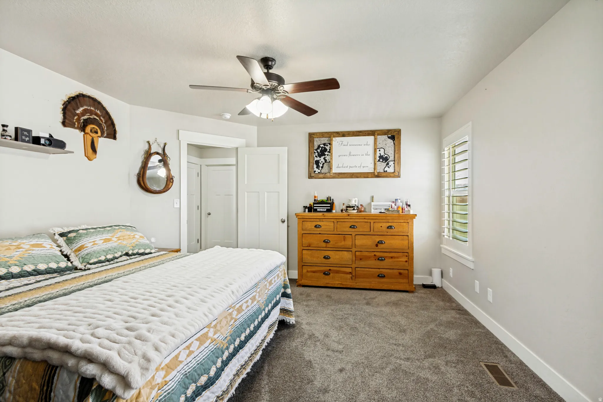 Interior room with light gray walls and gray carpeting