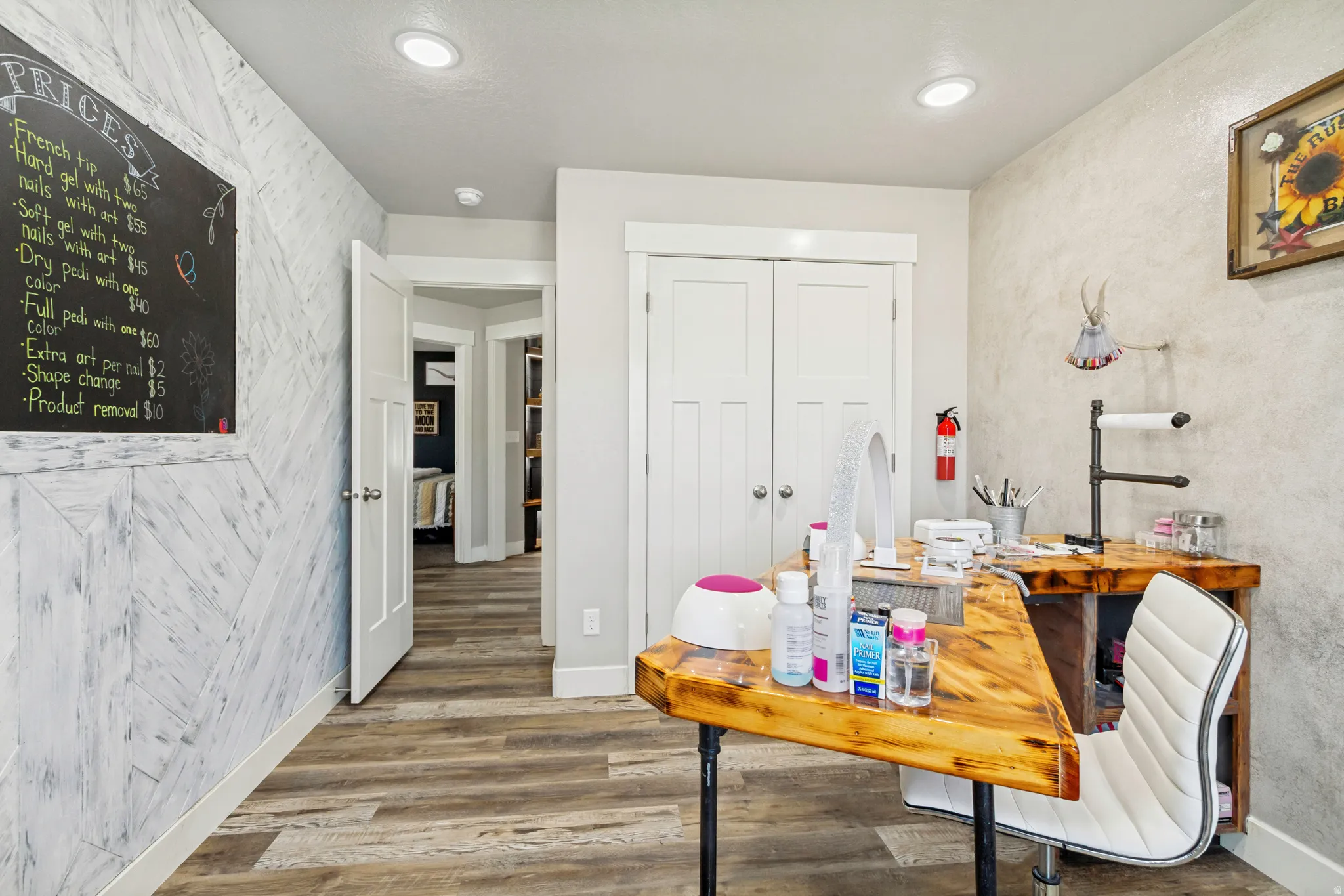 Versatile room featuring wood-finish flooring and recessed lighting