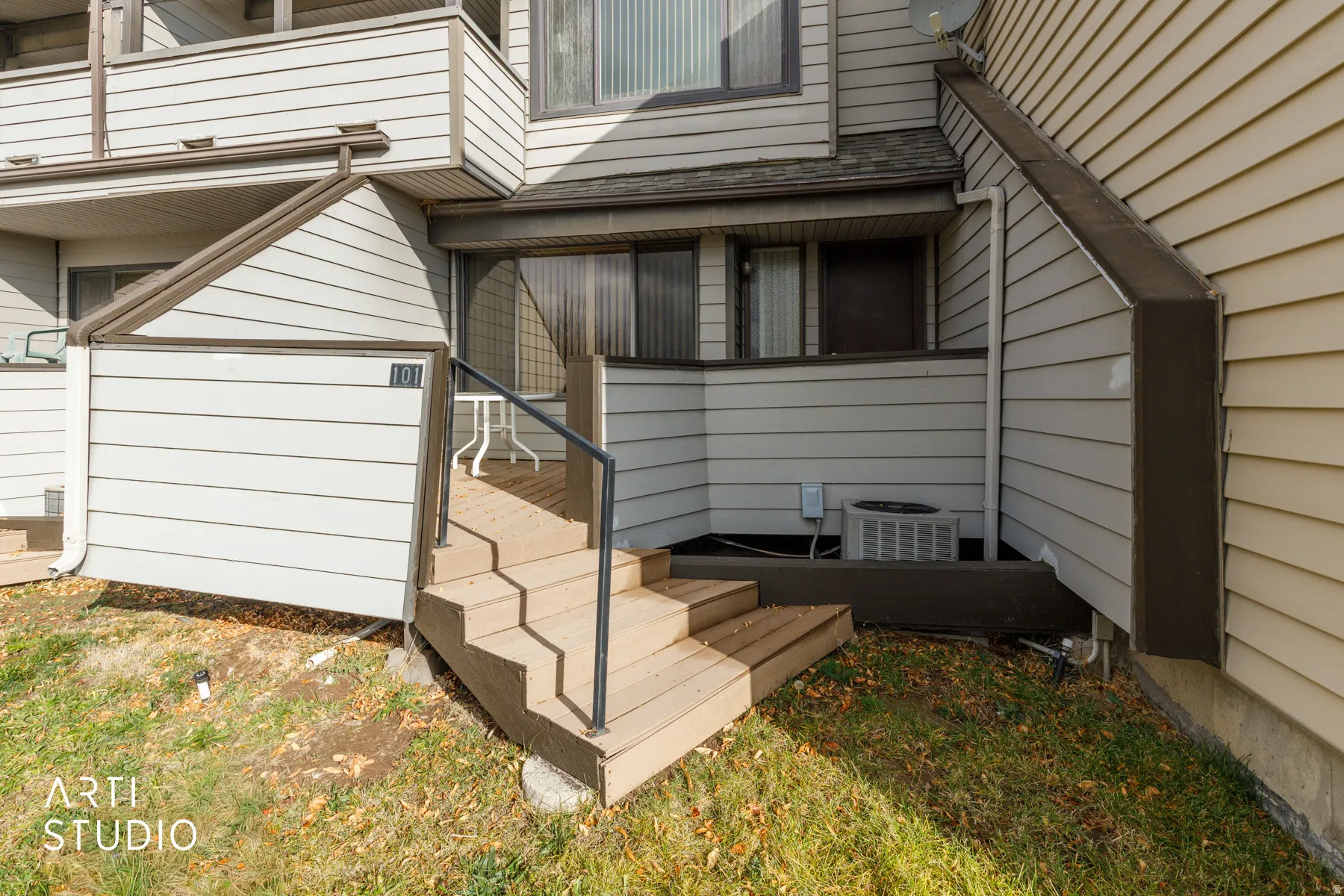 Entryway featuring a multi-level deck leading to a private patio