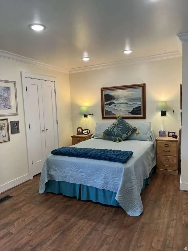 Warmly toned wood-finish flooring complements the light wall color