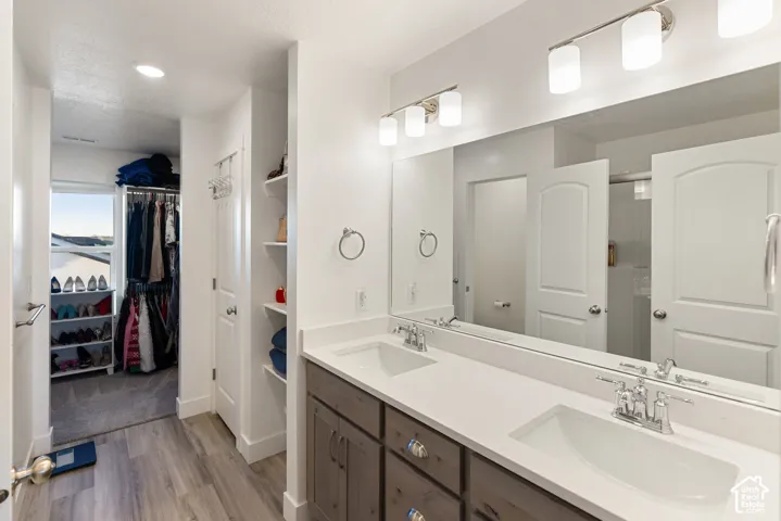 Double vanity with white countertops and undermount sinks