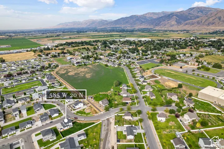 Aerial overview showcasing residential properties and surrounding landscape
