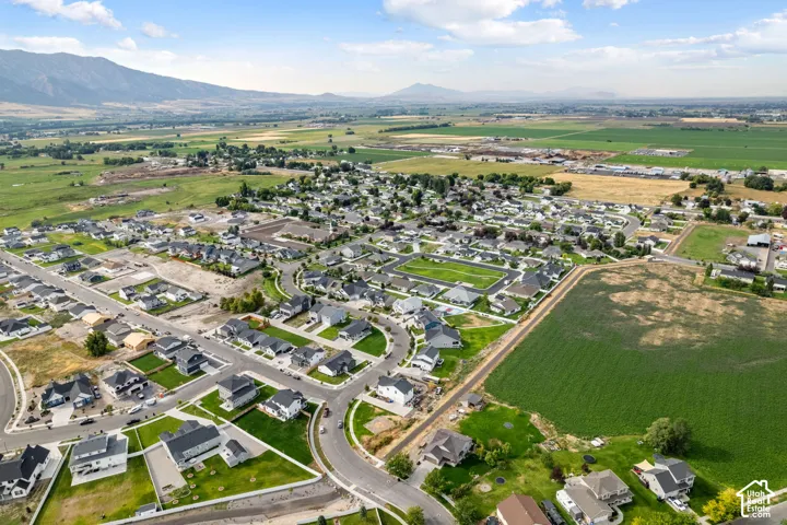 Expansive aerial perspective showcasing a residential development with numerous single-family homes