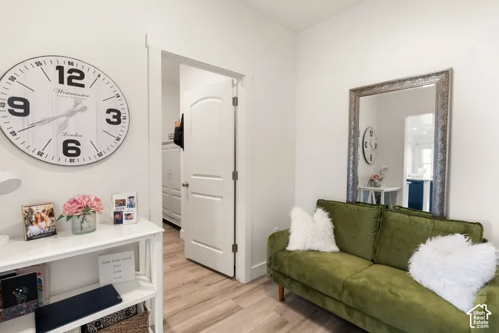 Interior space featuring wood-finish flooring and white walls