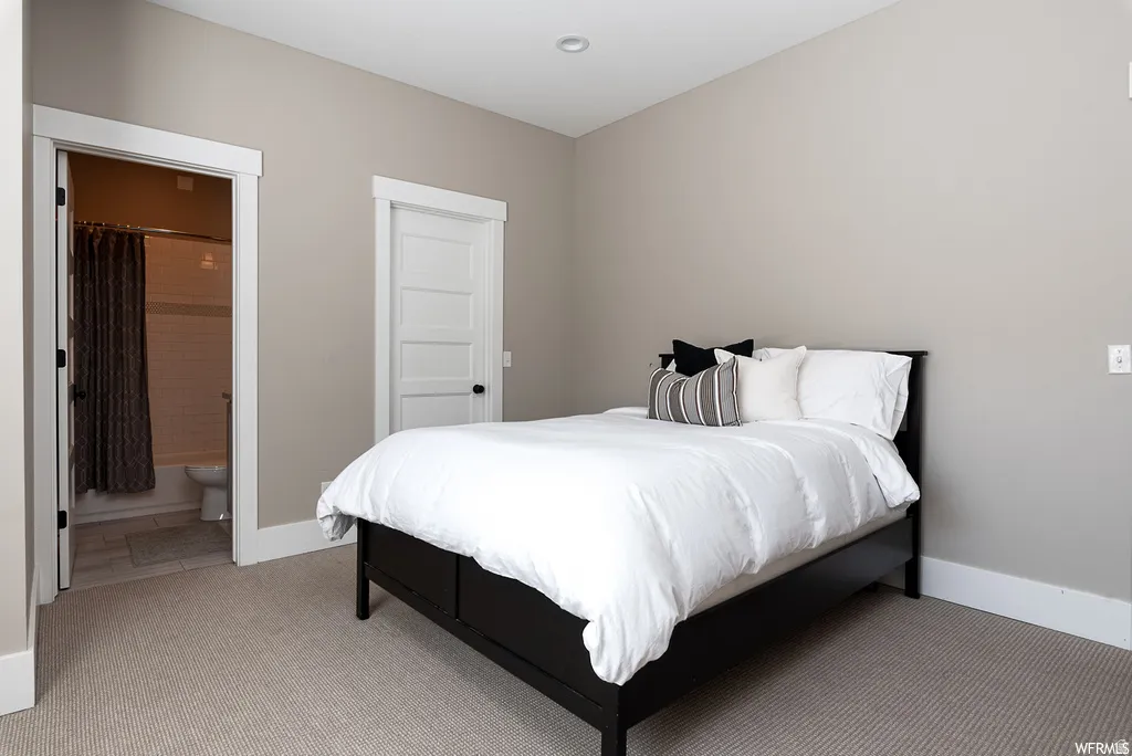 Carpeted room featuring neutral wall tones, white trim, and a built-in ceiling light