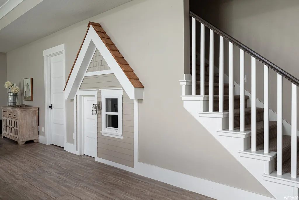 Custom built-in structure with shingle-style siding and a gable roofline