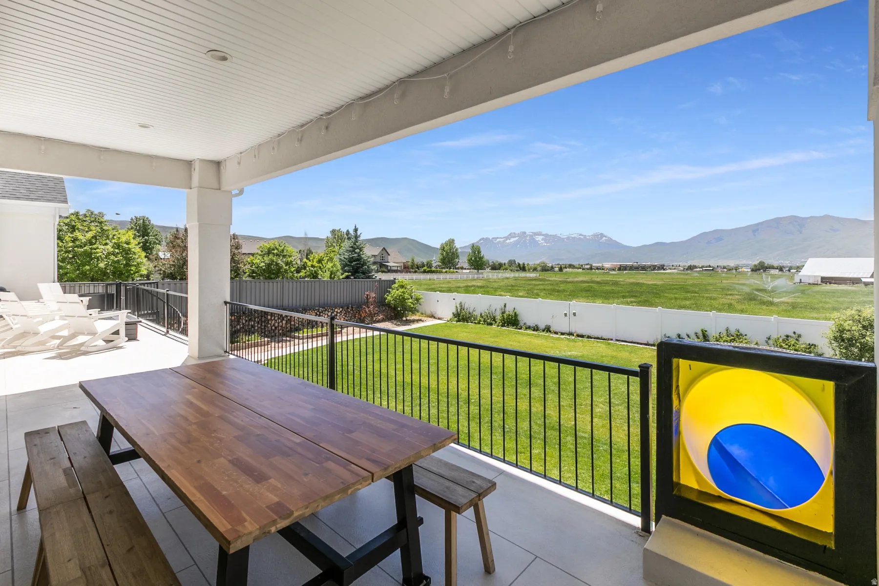 Covered patio with a white tongue-and-groove ceiling