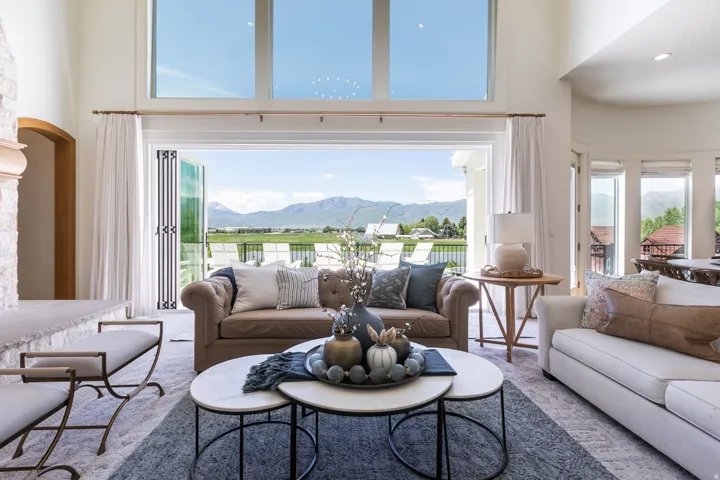 Open-concept living space featuring high ceilings and large windows