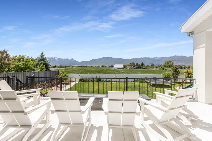 Expansive outdoor deck featuring composite decking and a black metal railing