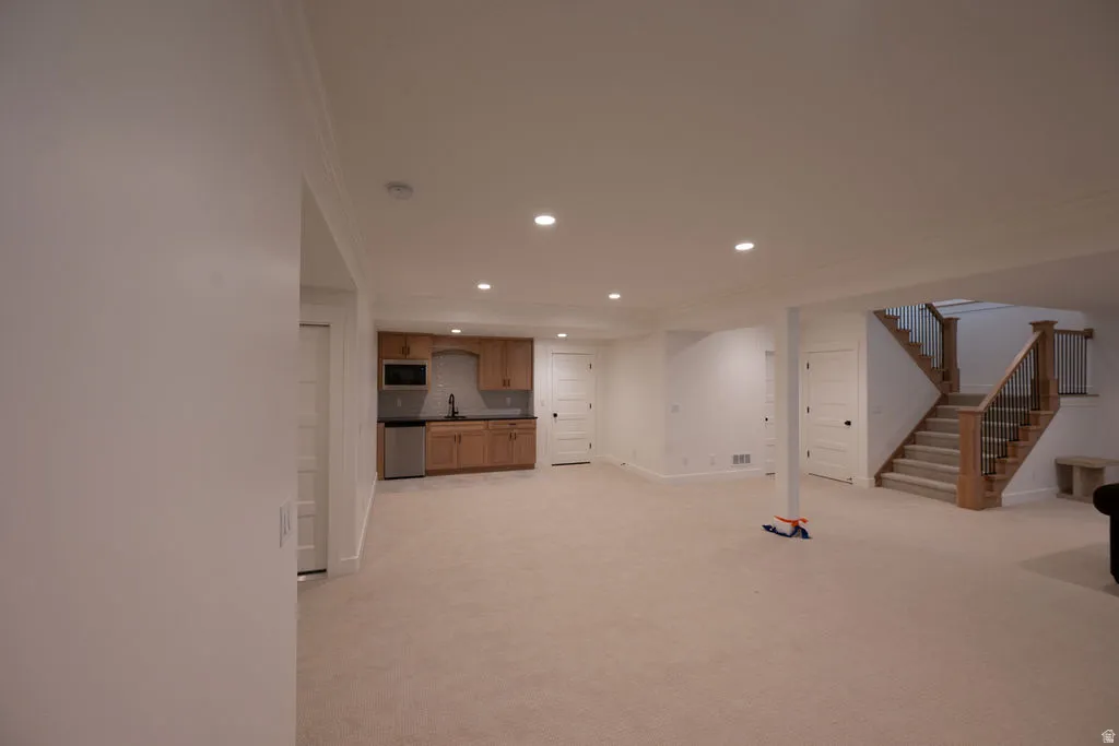 Expansive lower level featuring recessed lighting, a fully carpeted floor, and white trim