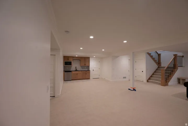 Expansive lower level featuring recessed lighting, a fully carpeted floor, and white trim