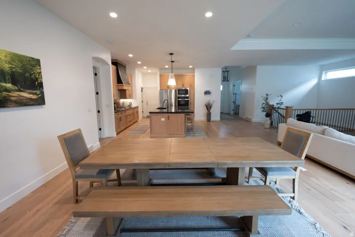 Open-concept living space featuring wood-finish flooring throughout