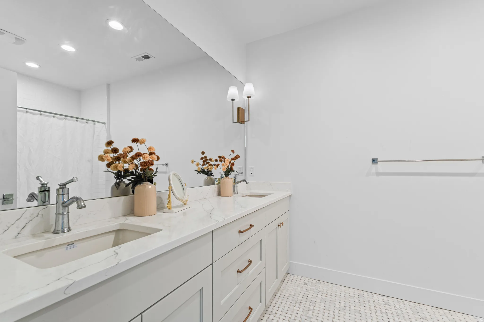 Dual vanity with stone-finish countertop and undermount sinks