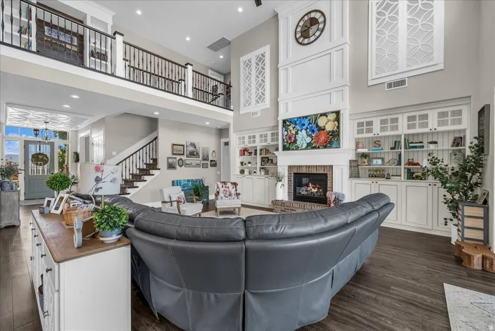 Two-story living area with a dark wood-finish flooring