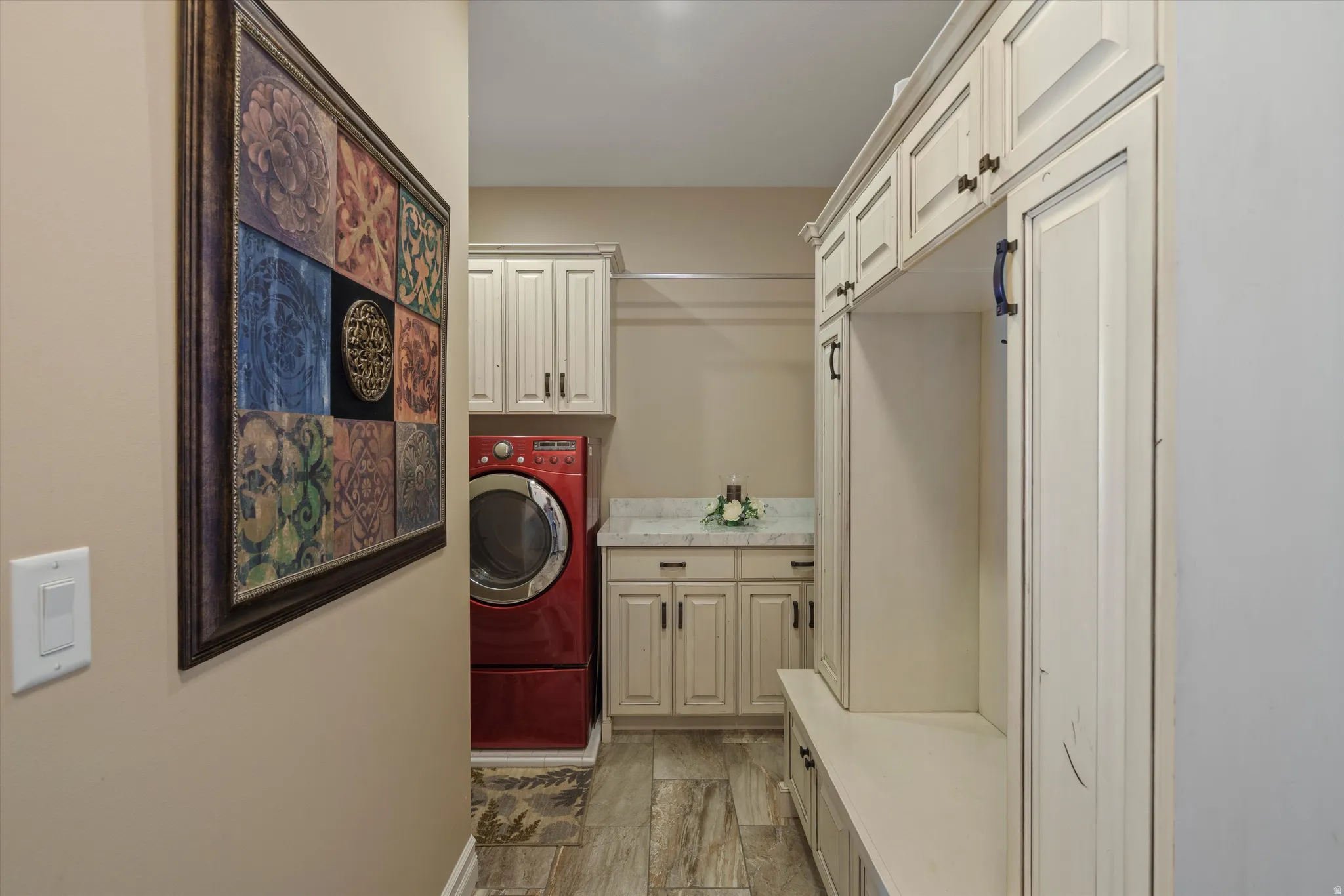Built-in cabinetry and bench seating featuring overhead storage