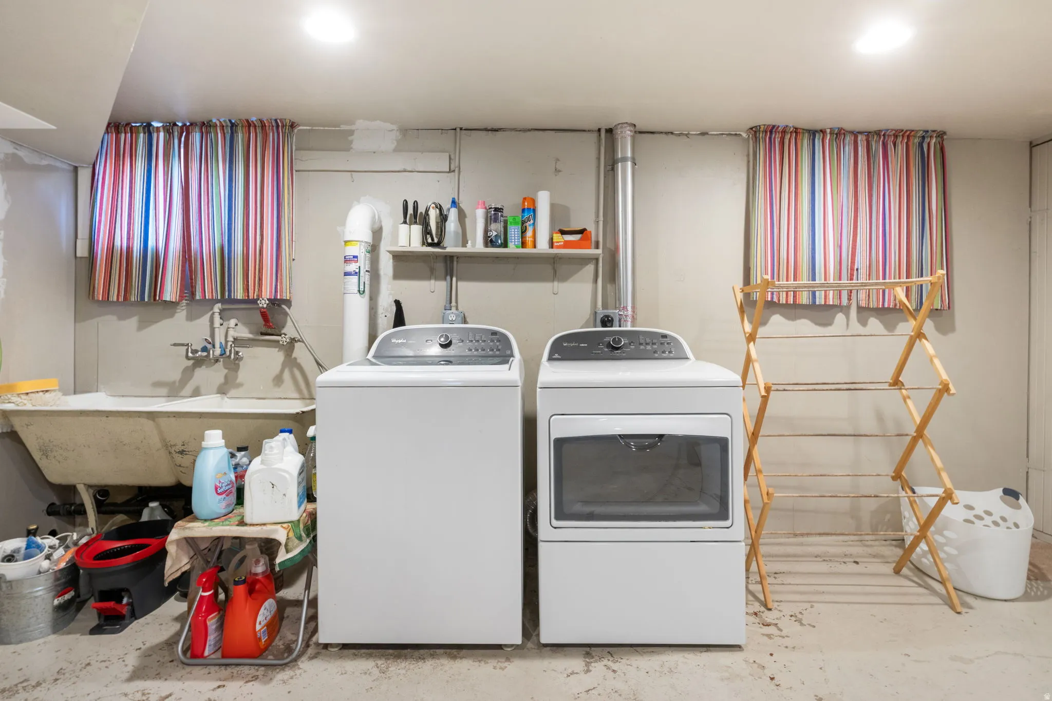 Dedicated laundry area featuring a white washing machine and a white dryer