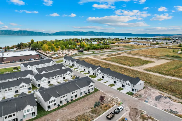 Aerial perspective of a multi-unit property featuring modern townhome architecture