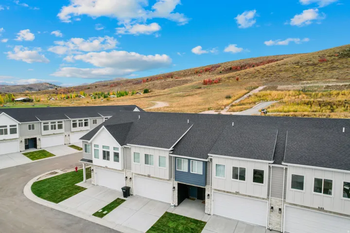 Modern townhome community featuring multi-level units with attached garages