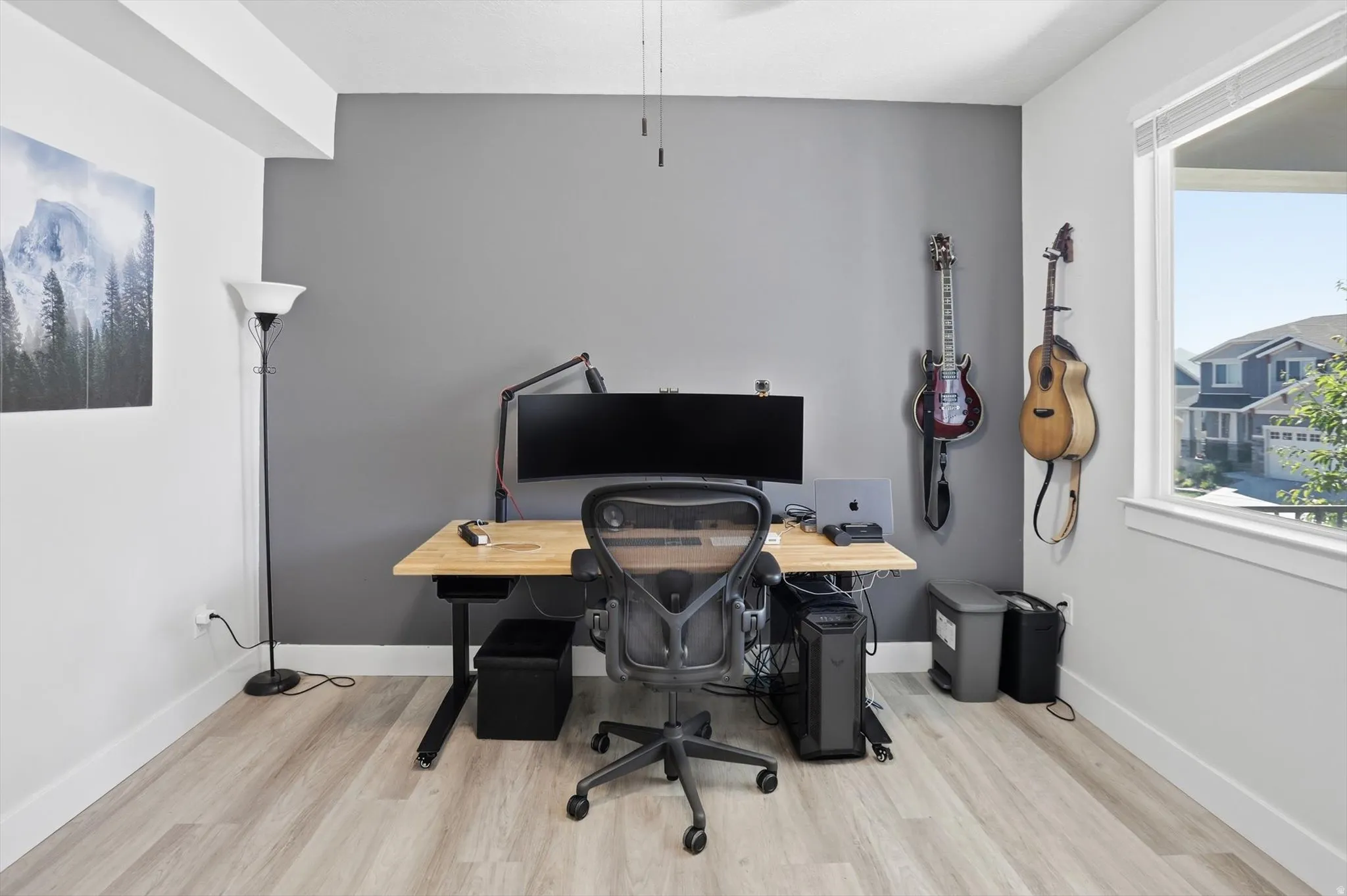 Bright interior room featuring light wood-finish flooring