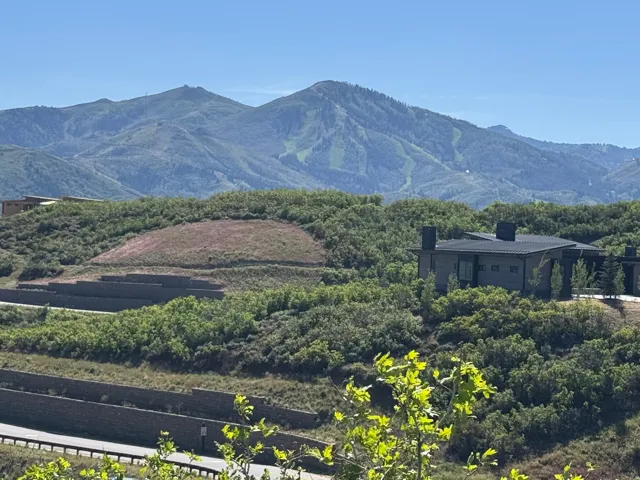 Contemporary architectural style residence set into a hillside with multiple retaining walls