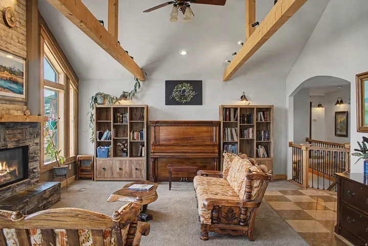 Vaulted ceilings featuring exposed wood beams and recessed lighting