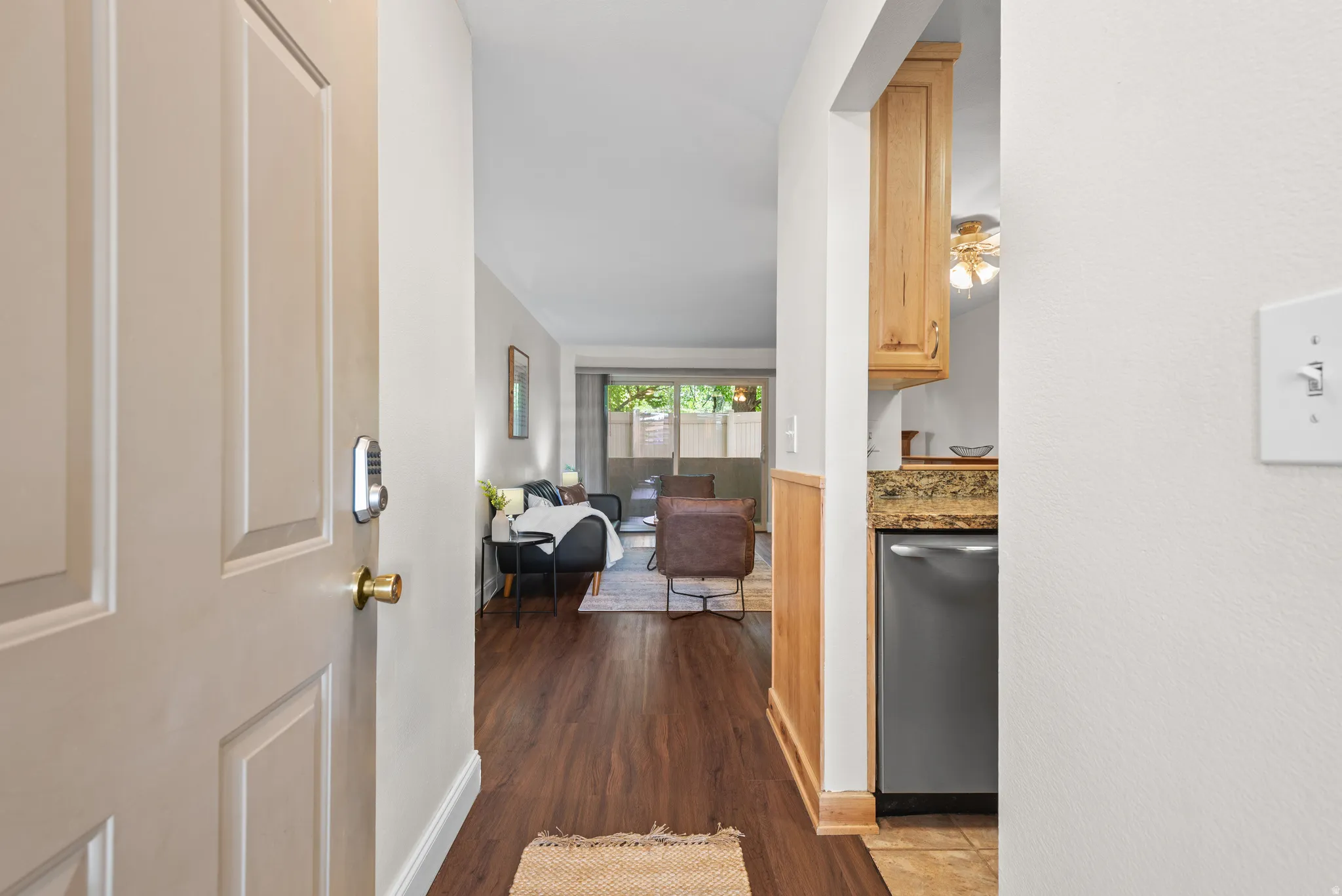 Entryway with wood-finish flooring extending into the living area
