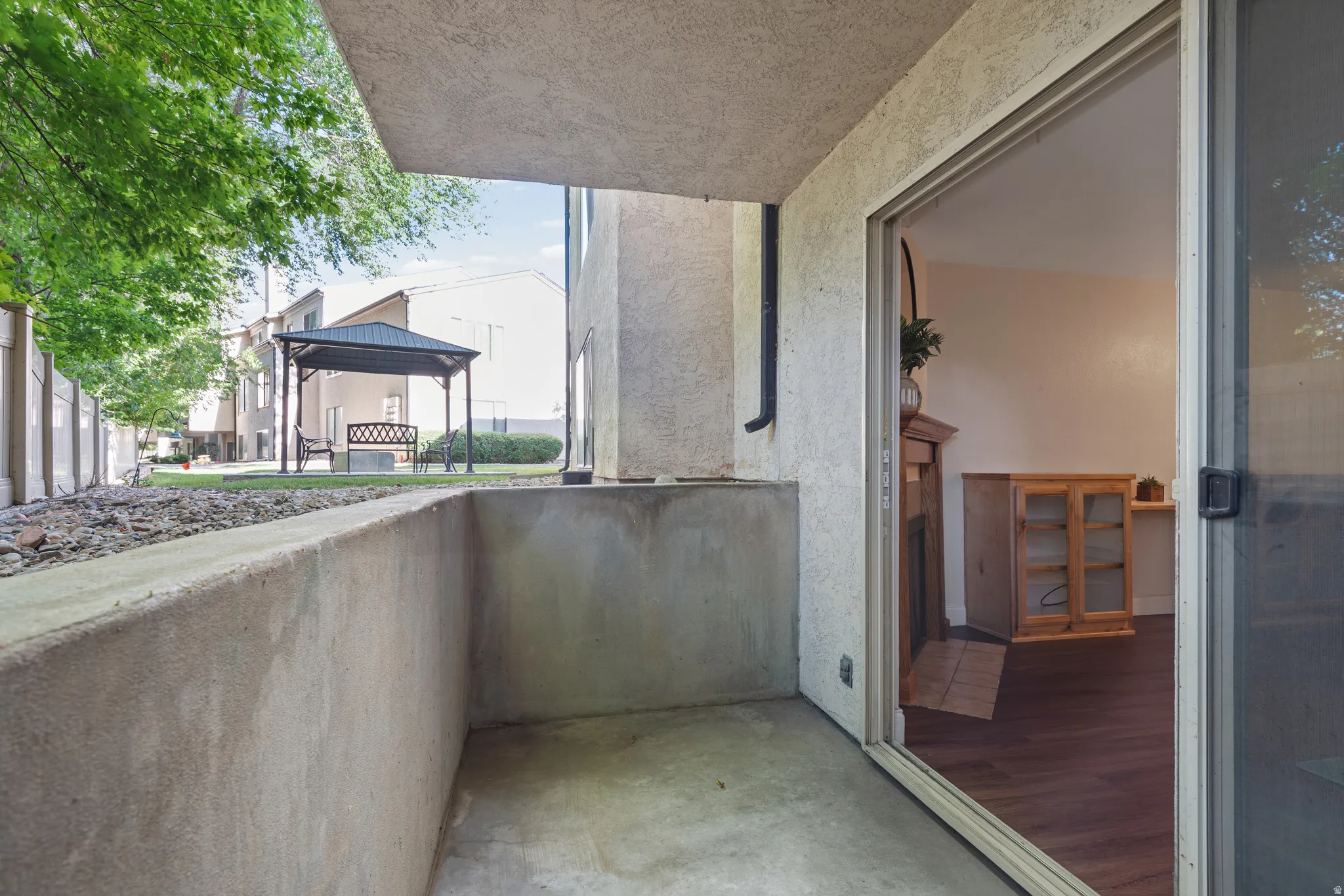 Private patio with concrete flooring