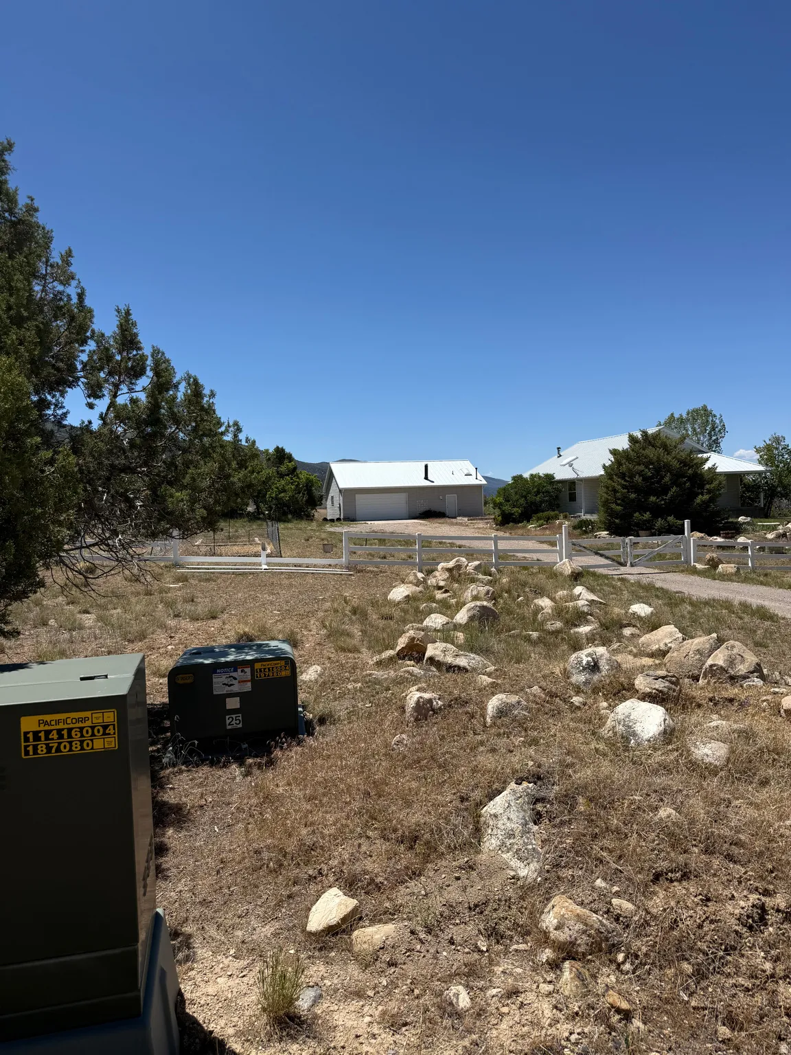 Expansive lot featuring natural rock outcroppings and mature perimeter trees