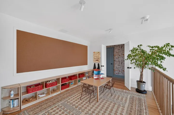Room featuring wood-finish flooring and white walls