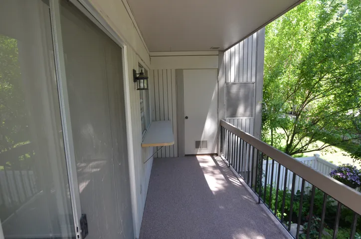 Deck off the front room with storage area