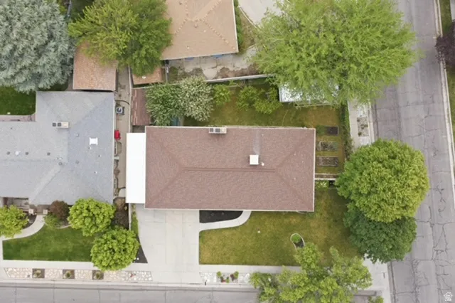 Brown shingle roof with a central chimney