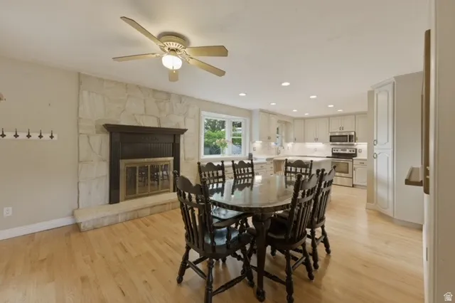 Open-concept living area featuring light wood flooring