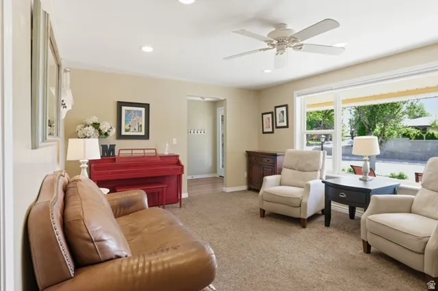 Light-filled living space with neutral wall tones and recessed lighting