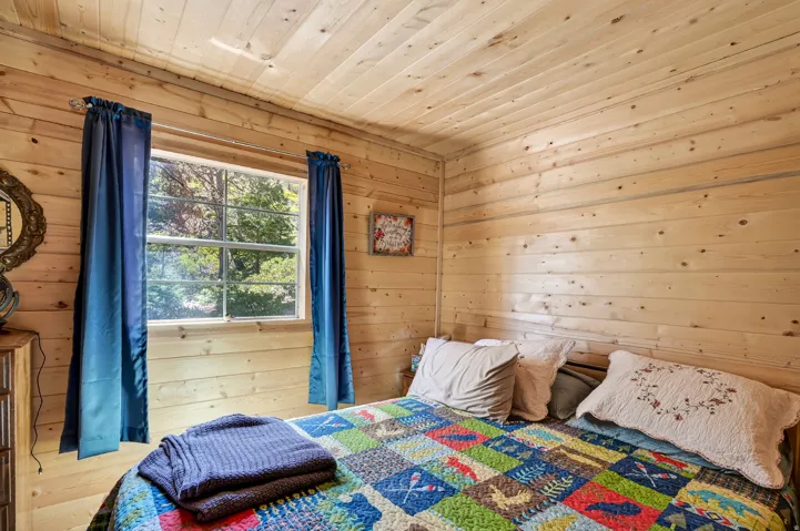 Room featuring extensive natural wood plank walls and ceiling