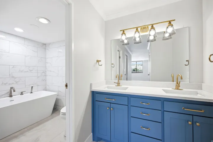 Updated bathroom with high-end finishes and soaking tub.