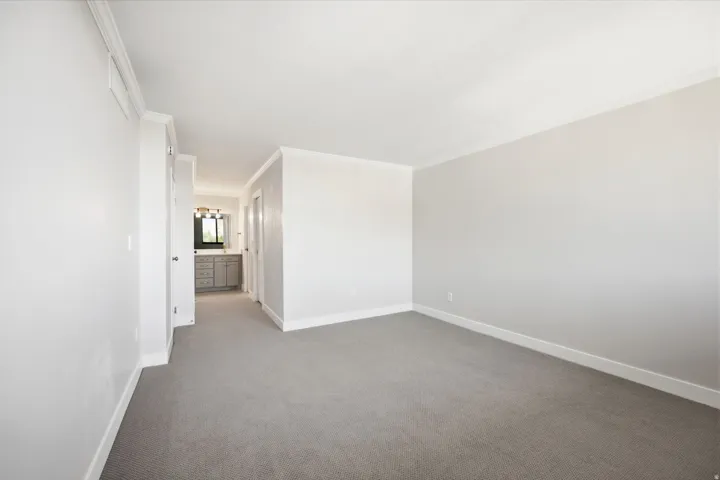 Bedroom two with new carpet and paint.