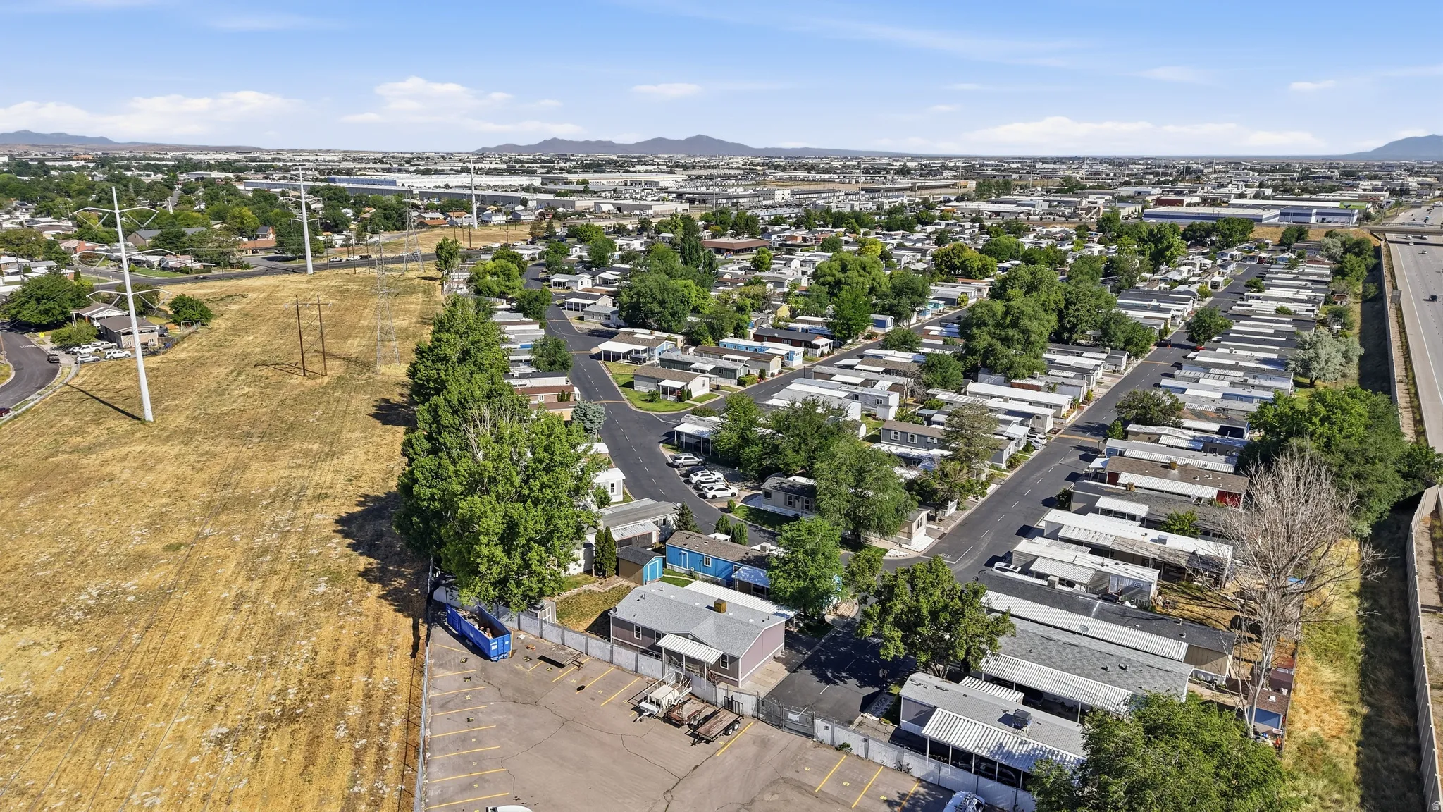 Aerial perspective showcasing a residential community with multiple single-story structures