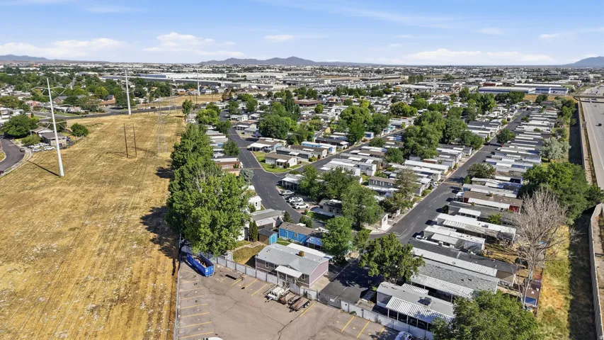 Aerial perspective showcasing a residential community with multiple single-story structures