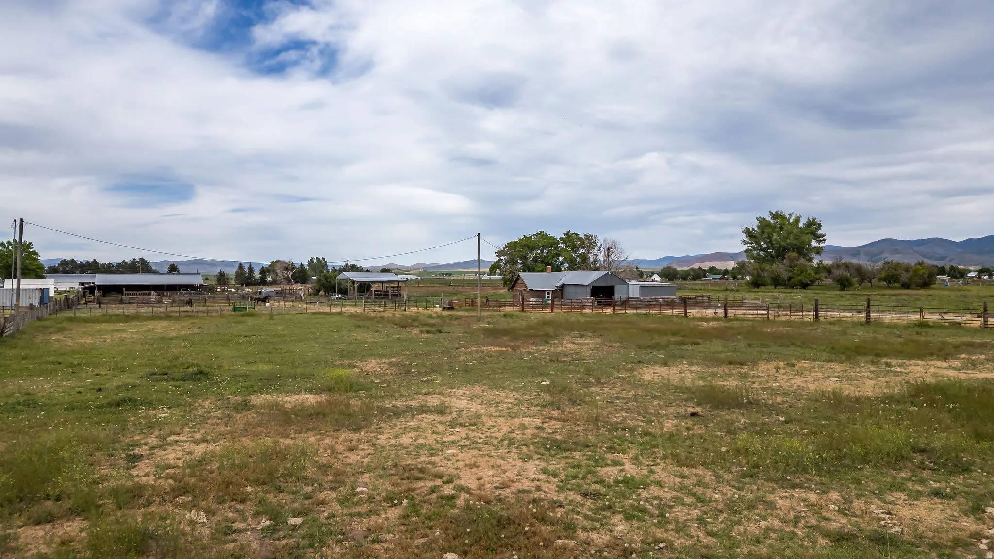 Expansive open field with distant mountain range