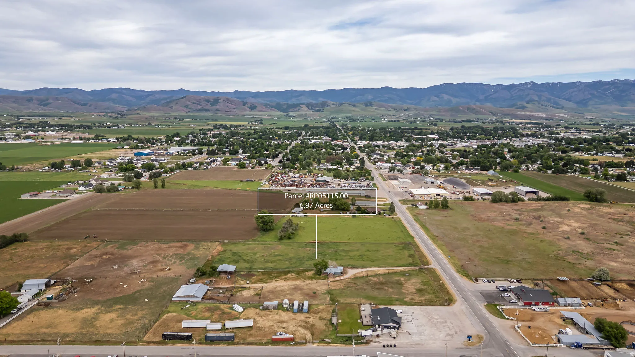 Expansive 6.97-acre parcel featuring a mix of cultivated land and green space