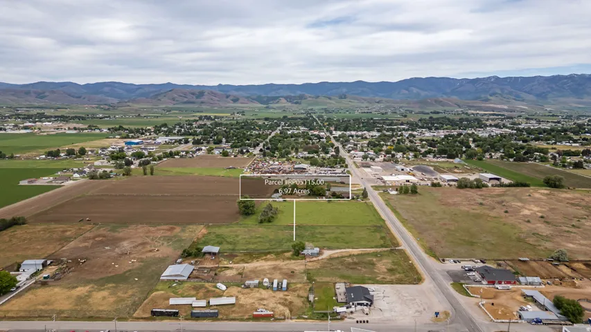 Expansive 6.97-acre parcel featuring a mix of cultivated land and green space
