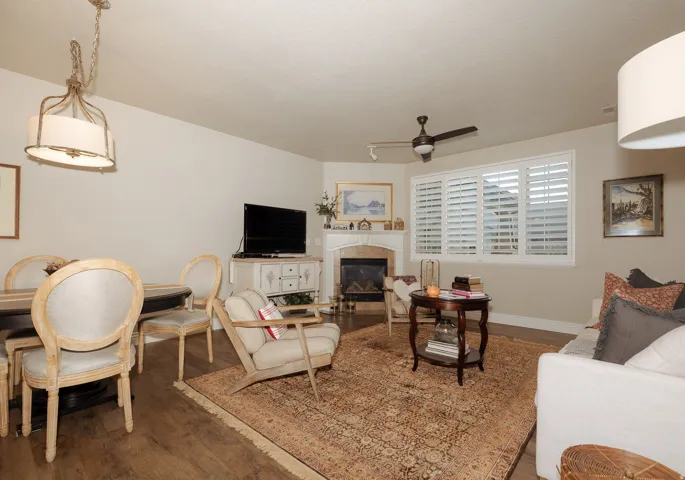 Open concept living space featuring wood-finish flooring