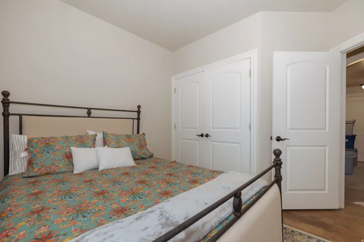 Interior room featuring a neutral color palette, white trim, and wood-finish flooring