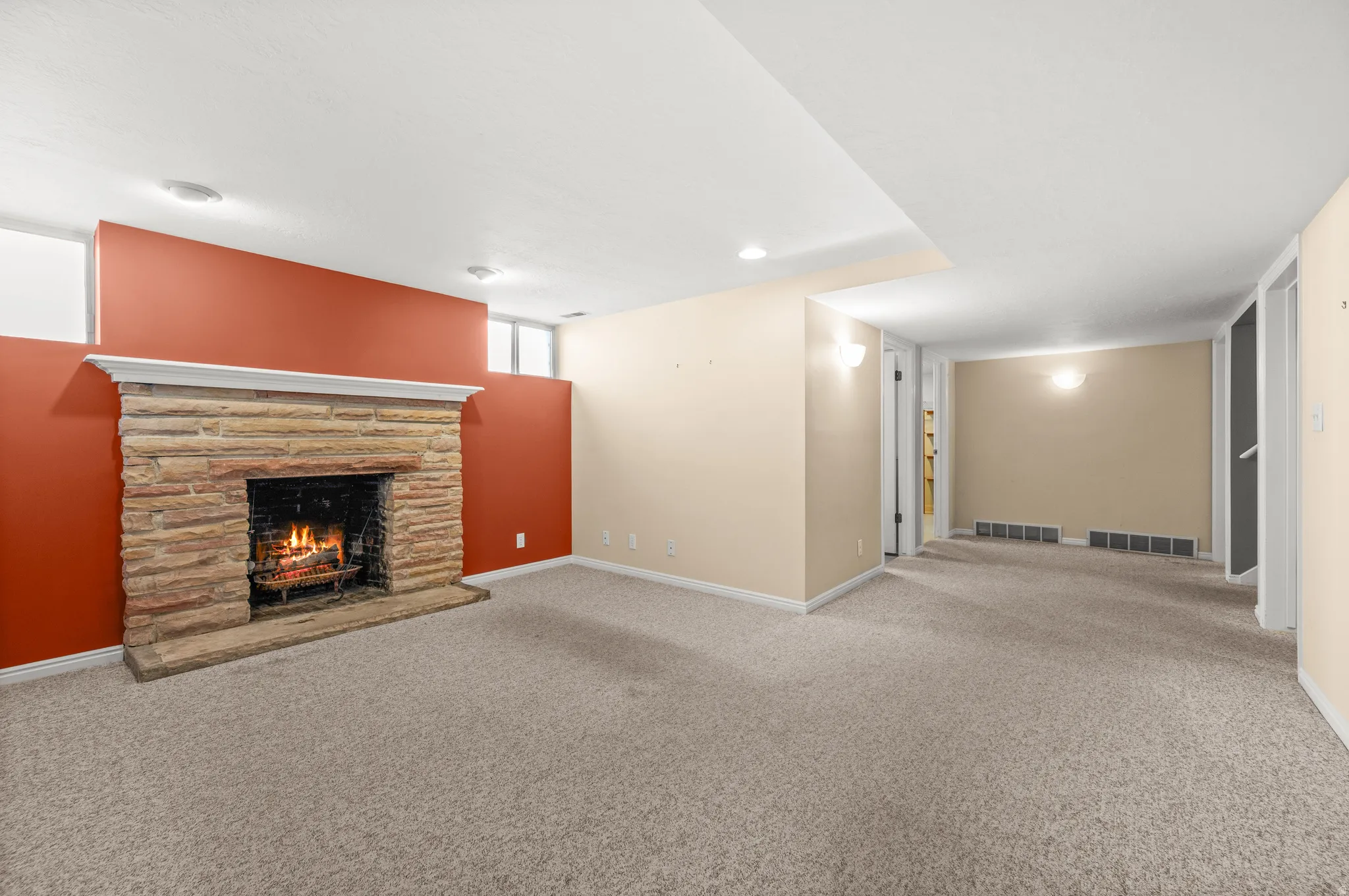 Stone fireplace with a white mantel and hearth